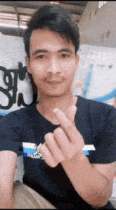 a man wearing a black t-shirt with the word italia on the front