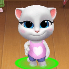 a white cat wearing a pink tank top with a heart on it