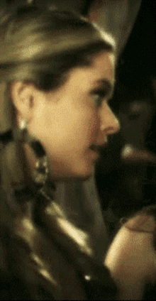 a close up of a woman 's face with a blurry background