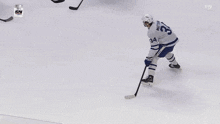 a hockey game is being played in front of a sign that says air canada