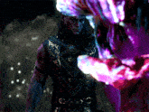 a man in a purple and gold outfit stands in front of a monster