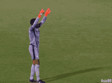 a soccer player wearing number 33 stands on a field