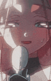 a close up of a cartoon character 's face with a microphone in her hand .