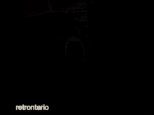 a blurred image of a building with retronario written on the bottom left