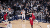 a basketball game is being played with a player wearing number 13