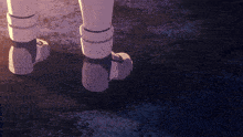 a close up of a person 's feet in a pair of white boots