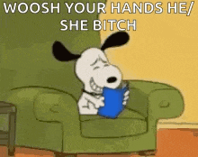 snoopy is sitting in a chair holding a book and saying woosh your hands he / she bitch .