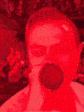 a close up of a man drinking from a cup