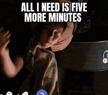 a man is holding a child in his arms and says all i need is five more minutes