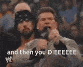 a man in a suit is holding his finger to his nose and says and then you dieeeee .