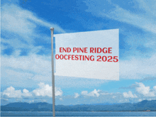 a white flag with the words end pine ridge oocfesting 2025 on it