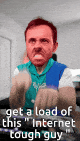 a man with an angry face and the words get a load of this " internet tough guy " on the bottom