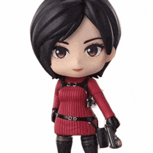 a doll with a red sweater and a black belt with the letter o on it