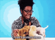 a woman is petting a bunch of puppies and says i can 't protect them
