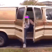 a man is getting out of a van with his door open