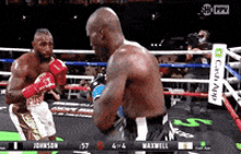 two boxers are fighting in a boxing ring with a credit app sign in the background