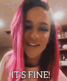 a woman with pink hair is smiling and saying `` it 's fine ! ''