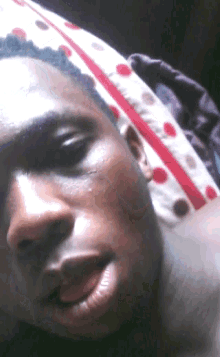 a close up of a man laying on a bed
