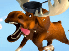 a moose with a frying pan on its antlers and a pink tongue sticking out