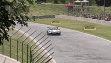 a bmw race car is driving on a track