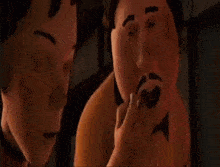 a group of cartoon characters are sitting in a diner talking to each other .