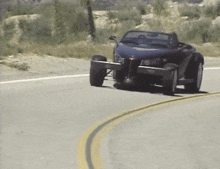 a purple car is driving down a road
