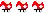a blurred image of a row of red hearts with a white cross on them on a white background .