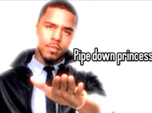 a man in a suit and tie is pointing at the camera with the words pipe down princess written above him