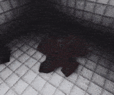 a red robot is laying on the floor in a room