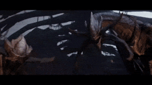 two monsters are fighting each other in the dark