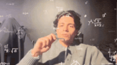 a man is surrounded by mathematical equations including one that says y = x + 2