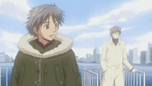 two anime characters are standing next to each other on a balcony