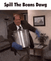 a man in a suit and tie is holding a large pot that says spill the beans dawg on the bottom