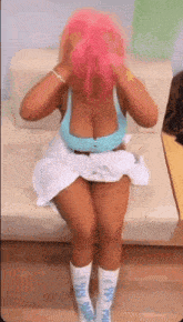 Nicki Minaj Giving Coke Pink Wig Sitting Moving Feet GIF - Nicki Minaj Giving Coke Pink Wig Sitting Moving Feet GIFs