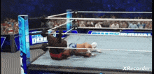 a video of a wrestling match with the words xrecorder on the bottom right