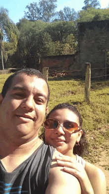 a man and a woman are posing for a picture