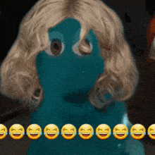 a row of smiley faces are lined up in front of a blue doll