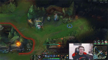 a man is playing a video game while wearing headphones and a red shirt .
