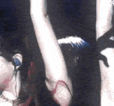 a close up of a person 's arm in a dark room with headphones on .