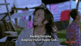 a man with long hair and a beard says awang serama