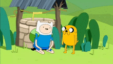 a cartoon character named finn is sitting next to a yellow dog