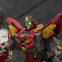 a red robot with yellow wings and green eyes is displayed in a video game