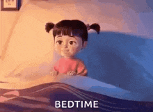boo from monsters inc is sitting in a bed with the words bedtime written on the bottom .
