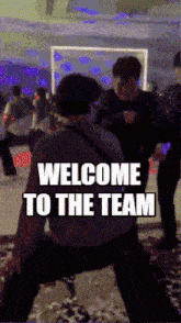 a group of people are dancing in a room with the words welcome to the team on the bottom
