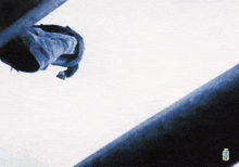 a picture of a person falling from a building with a sprite bottle in the corner
