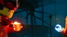 a man and a woman are standing next to each other and one of them is holding a fireball