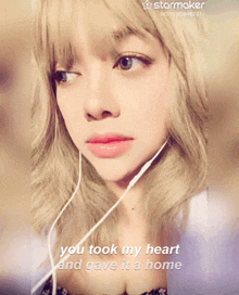 a woman is wearing headphones and the words you took my heart and gave it a home