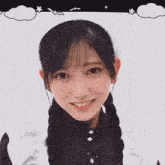 a close up of a girl 's face with braids and a cloud in the background
