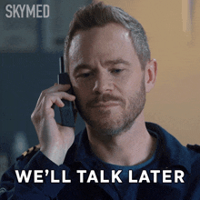 a man talking on a cell phone with the words we 'll talk later behind him