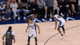 a basketball game is being played on a court that has the word netflix on it